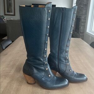 Deep blue John Fluevog knee high boots with wood heel.
